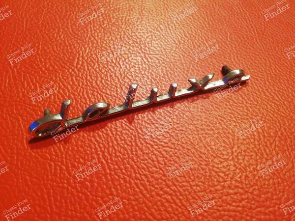 Deluxe' trunk sign - FORD Anglia 105E / Torino - 0